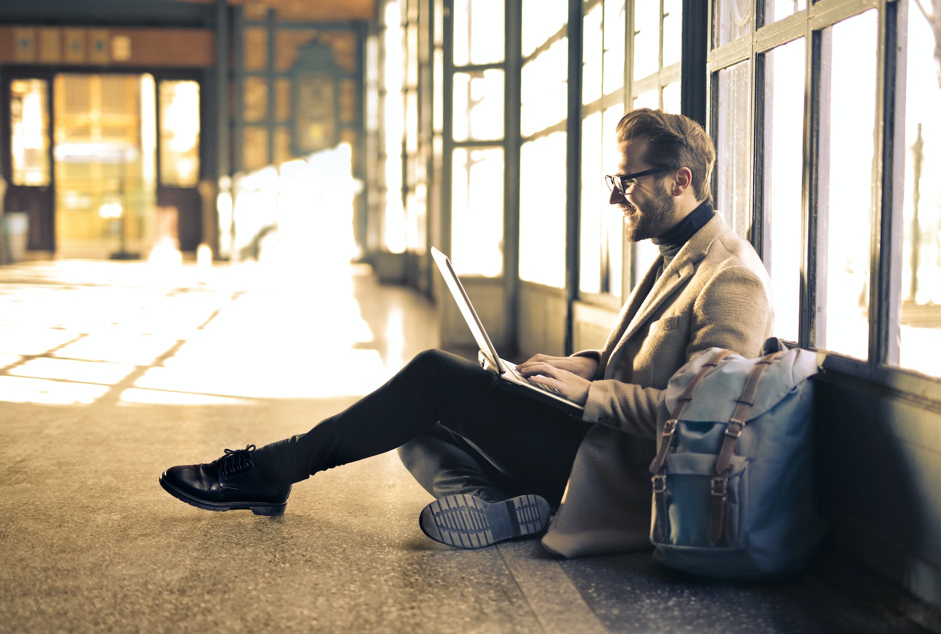 Man on laptop wearing blue light glasses